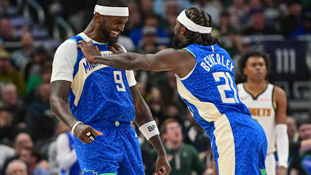 Milwaukee Bucks forward Bobby Portis (9) celebrates with guard Patrick Beverley (21)